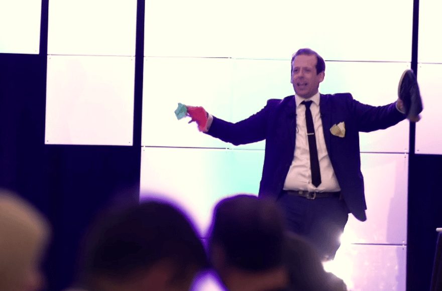 Eric Lerner on a conference stage during a general session